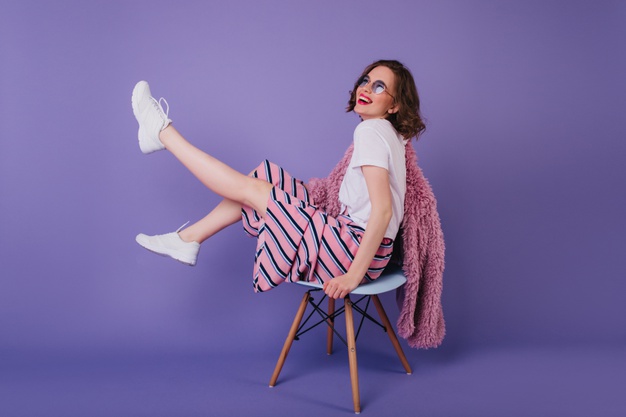blissful-young-lady-sunglasses-fooling-around-during-photoshoot-chair-laughing-winsome-girl-white-shoes_197531-5165